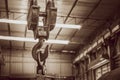 Hoist crane hook in factory warehouse brown vintage color tone Royalty Free Stock Photo