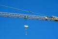 Hoist crane restoration hanging hook blue sky detail close up