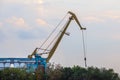 Hoisting crane in the industrial zone of the port Royalty Free Stock Photo