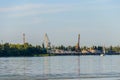 Hoisting cranes at cargo port on the Dnieper river in Kremenchug, Ukraine Royalty Free Stock Photo