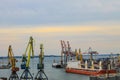 Hoisting cranes and industrial ships at cargo sea port in Odessa, Ukraine