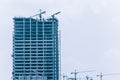 Hoisting cranes under construction crane working building construction Royalty Free Stock Photo