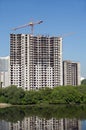 Hoisting tower crane in construction building process