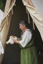 Hojbjerg, Denmark, July 29, 2023: The hostess in the tent in rain at the Viking Festival