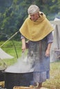 Hojbjerg, Denmark,July 29,2023: woman boils clothes at Viking festival