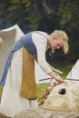 Hojbjerg, Denmark, July 29, 2023: Woman makes oven at Viking festival
