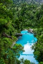 Hokitika Gorge, West Coast, New Zealand. Beautiful nature with blueturquoise color water and wooden swing bridge Royalty Free Stock Photo