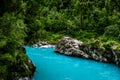 Hokitika Gorge, West Coast, New Zealand. Beautiful nature with blueturquoise color water and wooden swing bridge Royalty Free Stock Photo