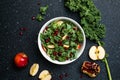 Hokkaido apple and quinoa salad with kale, pomegranate, spring onion and toasted sunflower seeds. Healthy homemade food. Vegan Royalty Free Stock Photo