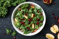 Hokkaido apple and quinoa salad with kale, pomegranate, spring onion and toasted sunflower seeds. Healthy homemade food. Vegan Royalty Free Stock Photo