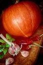 Making a Hokkaido pumpkin soup, ingredients on the chopping board Royalty Free Stock Photo