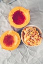 Hokkaido pumpkin cut in half- removing seeds Royalty Free Stock Photo