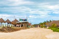 Sandy street and windy cloudy beach sandbank on Holbox Mexico