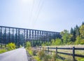 Holcomb creek wooden train trestle Old tall wooden railway bridge across the valley Royalty Free Stock Photo