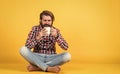 Hold cup of coffee or tea. lifestyle concept. handsome hipster man with cup of coffee. he is taking a coffee break Royalty Free Stock Photo