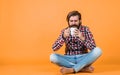 Hold cup of coffee or tea. lifestyle concept. handsome hipster man with cup of coffee. he is taking a coffee break Royalty Free Stock Photo