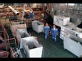 Hold the lay barge. Workers go to the shop. Warehouse of pipes and ancillary equipment. Preparation and assembly of the underwater