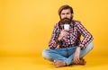 Hold paper cup of coffee or tea. lifestyle concept. handsome hipster man with cup of take away coffee. he is taking Royalty Free Stock Photo