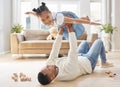 Hold on tight, love them just right. a young father and daughter bonding while playing on the floor at home. Royalty Free Stock Photo