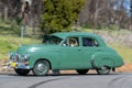 1953 Holden FX driving on country road Royalty Free Stock Photo