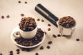 holder for coffee maker, cup and scattered beans/holder for coffee maker, cup and scattered beans on stone background Royalty Free Stock Photo