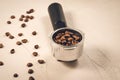 holder filled with coffee beans/Filter holder filled with coffee beans on a concrete background. Selective focus Royalty Free Stock Photo