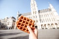 Holding belgian waffle outdoors