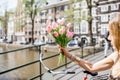 Holding tulips in Amsterdam Royalty Free Stock Photo