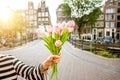 Holding tulips in Amsterdam Royalty Free Stock Photo