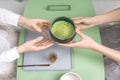 Holding bowl with green matcha tea