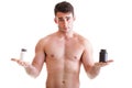 Holding a boxes with supplements on his biceps Royalty Free Stock Photo