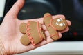 Holding a broken gingerbread man. Close-up, selective focus, Christmas