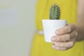 holding a cactus in his hands, two rings, concept complicated relationship Royalty Free Stock Photo