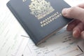 Holding Canada passport with boarding pass