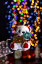 Holding Christmas decoration isolated on background with blurred lights. December season, Christmas composition Royalty Free Stock Photo