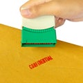 Holding a confidential stamper Royalty Free Stock Photo