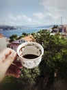 Holding a cup of turkish coffee against sea view in Istanbul, Turkey Royalty Free Stock Photo