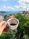 Holding a cup of turkish coffee against sea view in Istanbul, Turkey Royalty Free Stock Photo