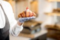 Holding delicious croissant Royalty Free Stock Photo