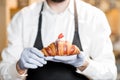 Holding delicious croissant Royalty Free Stock Photo