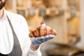 Holding delicious croissant Royalty Free Stock Photo