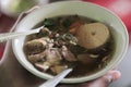 Holding delicious indonesian soup