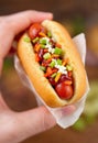 holding delicious mini hot dog selective focus Royalty Free Stock Photo