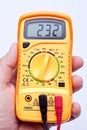 Holding digital multimeter Royalty Free Stock Photo