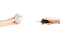 Holding female hands with keys of car and stack of dollars on white background. Royalty Free Stock Photo