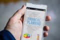 holding financial planning smartphone