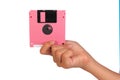 Holding floppy disc on white background. Computer floppy disk in Royalty Free Stock Photo