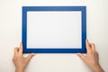 Holding frame mockup. Photo Mockup. Woman hands hold blue frame. For frames and posters design. Frame size A4. blank photo frame Royalty Free Stock Photo