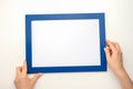 Holding frame mockup. Photo Mockup. Woman hands hold blue frame. For frames and posters design. Frame size A4. incline blank photo Royalty Free Stock Photo