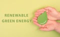 Holding a green drop, renewable green energy, alternative bio fuel, recycling resourses, sustainability lifestyle, ecology concept Royalty Free Stock Photo